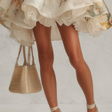 Abito mini A-line in organza floreale beige con bordino in pizzo
