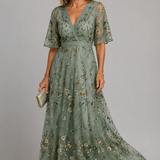 Solenne | Abito midi floreale con collo a halter